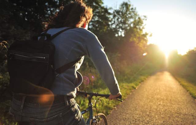 Person cycling on cycle path - credit Sustrans