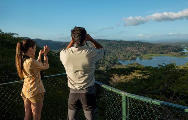 Couple birdwatching on the top of the Canopy Tower At Gamboa