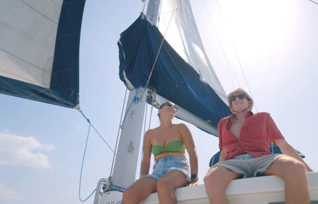 Couple enjoying a sailing trip in the Pacific waters of West Panama Province.