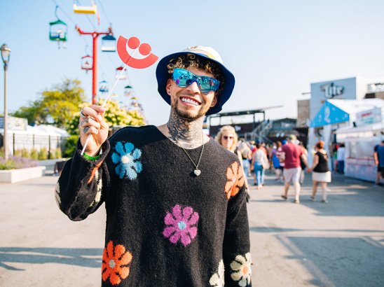 man smiling in a flower setting