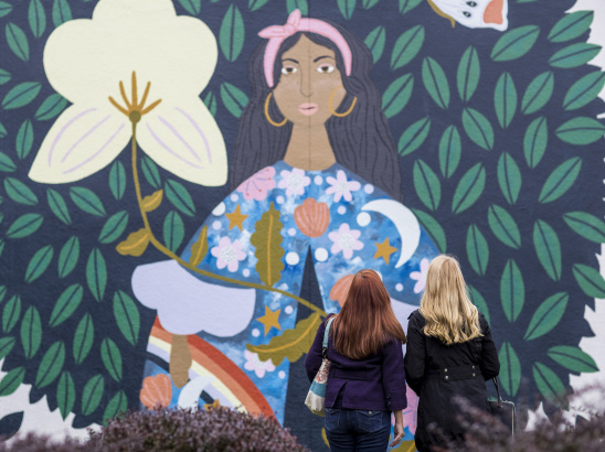 012 Women Looking at What Blooms is Us Mural Along North Avenue in Wauwatosa