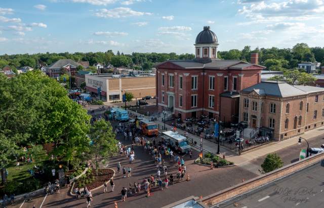 Aerial Photo of the Old Courthouse Center with food trucks lined up and crowds of people on the square.