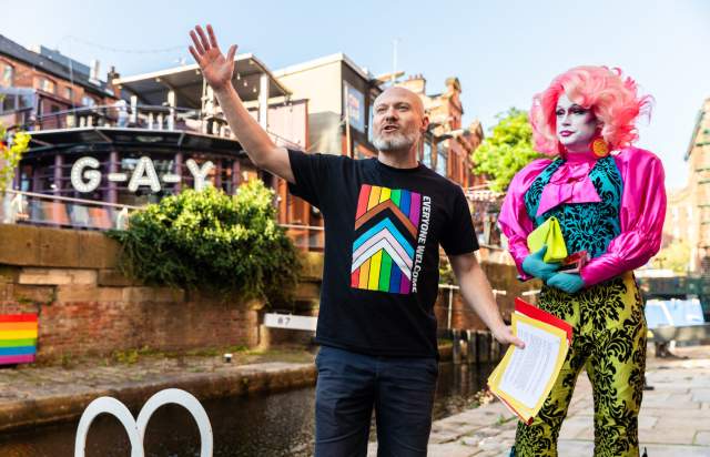Tour guide on Manchester's Canal Street delivering LGBT tour of the city