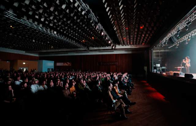 Comedian on stage at New Century Hall