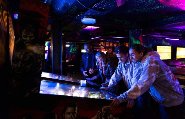 Couple playing arcade game in NQ64