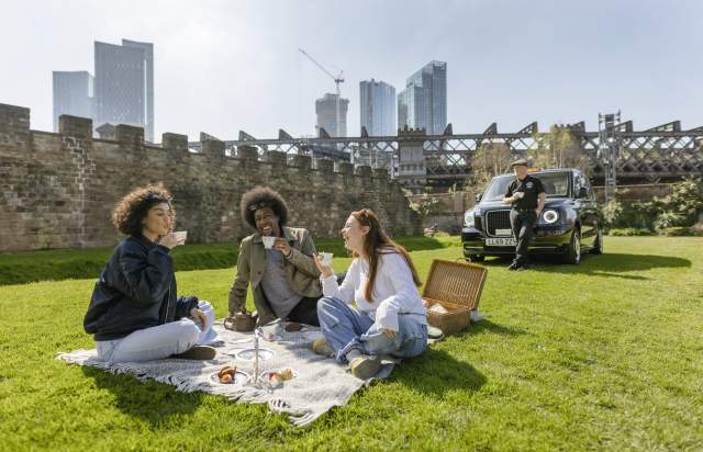 Friends enjoying a picnic in the sun in Castlefield
