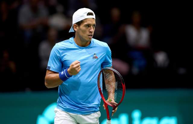 Tennis player celebrating on the court