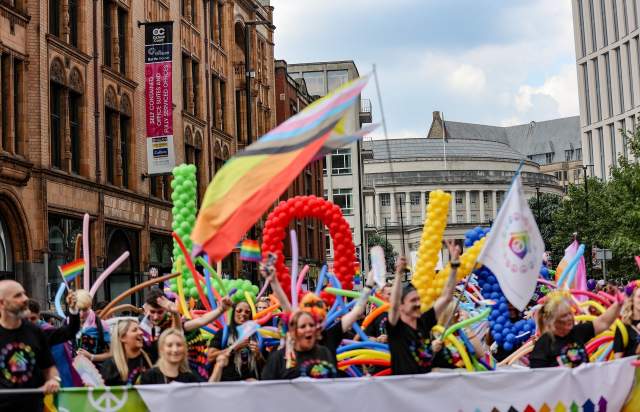 People celebrating Manchester Pride during the parade