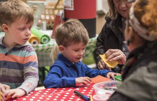 Children doing crafts at a table
