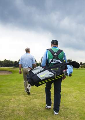 Golfer and Caddy