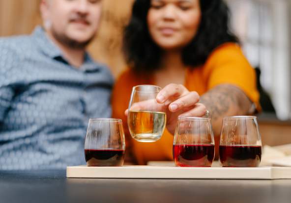 couple selecting from a wine flight