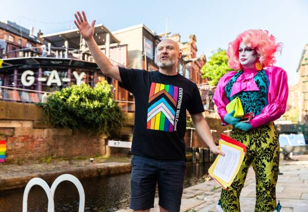 Tour guide on Manchester's Canal Street delivering LGBT tour of the city