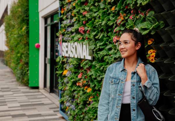Person stood in front of living green wall