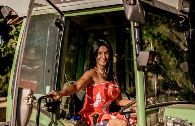 America of Oastbrook Vineyard sat in her tractor smiling