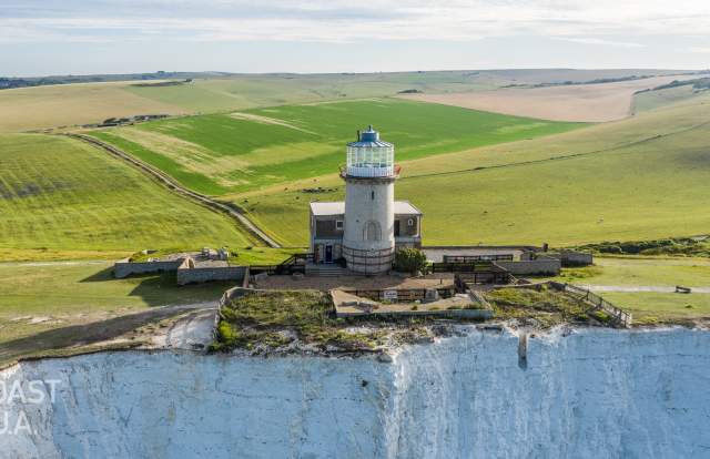 The Belle Tout Lighthouse hotel on the edge of the cliffs overlooking the sea