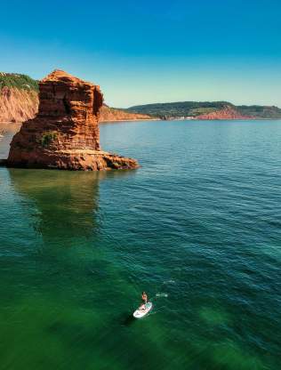 woman paddle boarding east devon