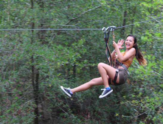 Orlando Tree Trek Adventure Park girl on zipline