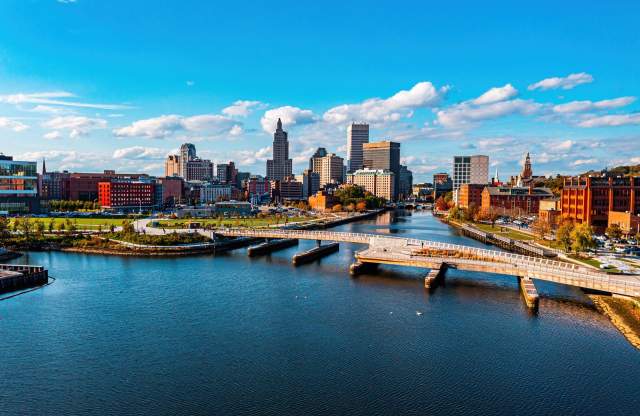 The Providence River Pedestrian Bridge spanning the Providence River with the Providence skyline in the background.