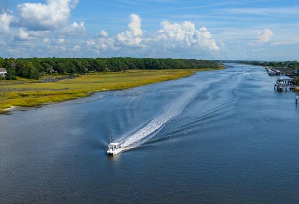 a boat traveling along the Intracoastal Waterway in Ocean Isle Beach
