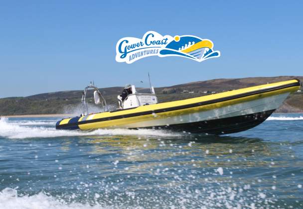 A man on a speedboat on the water.