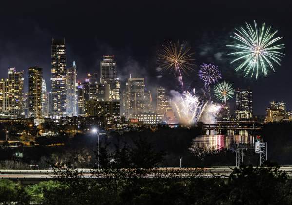 Fireworks over the downtown Austin skyline at night