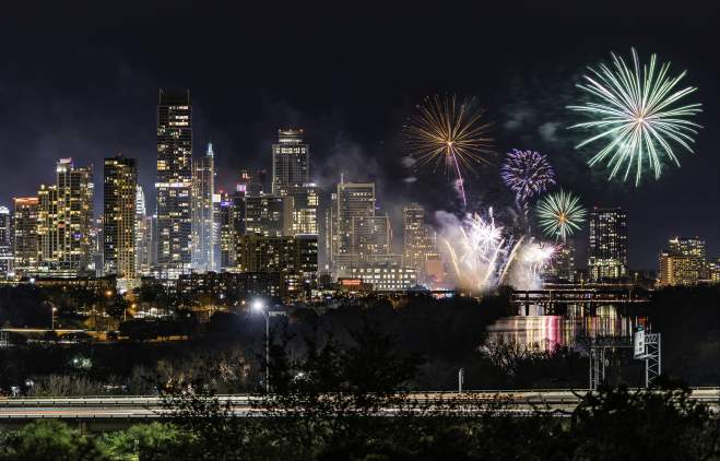 Fireworks over the downtown Austin skyline at night