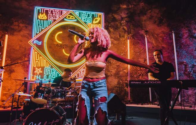 Melat performing at Cheer Up Charlie's