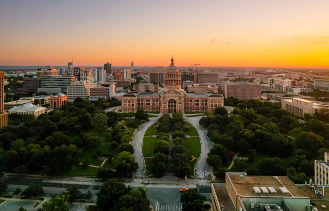 Sunrise aerial view of the Texas State Capitol grounds.