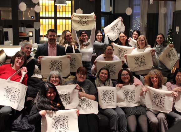 group image holding canvas bags