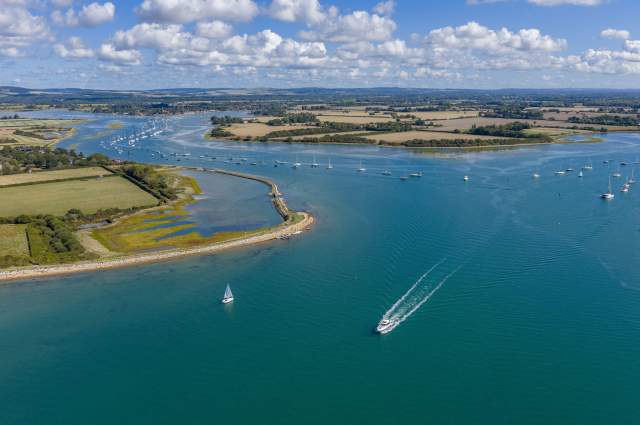 Itchenor Channel  as viewed from the air, a wide water view with boats and landscape