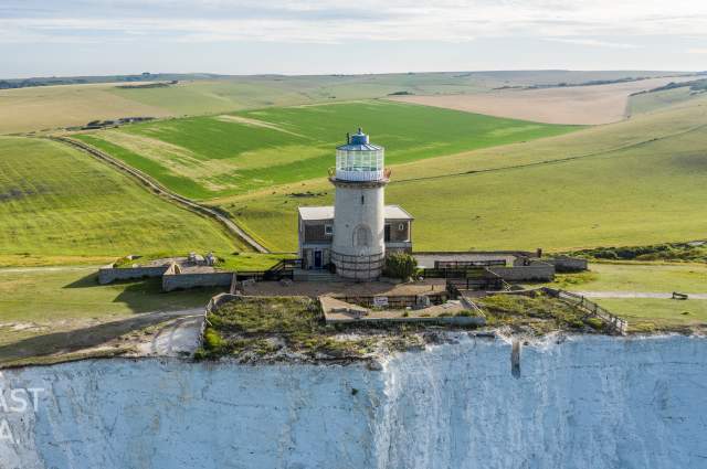 The Belle Tout Lighthouse hotel on the edge of the cliffs overlooking the sea