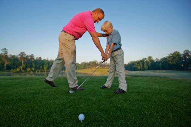 Two golfers standing on golf course