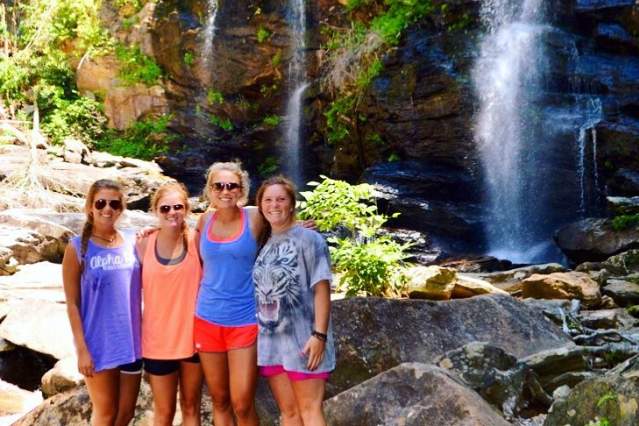 Women in front of waterfall