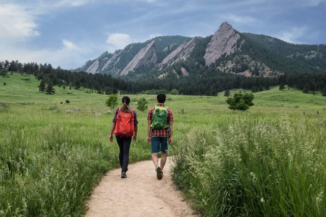 Man and Woman Hiking Chautauqua Flatirons in Boulder