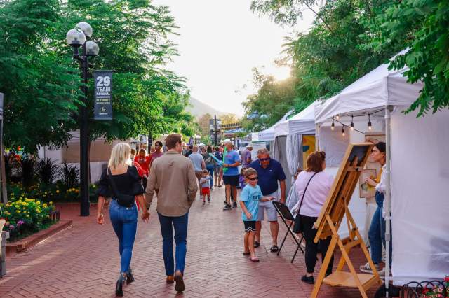 White tents for artists booths are set up on Pearl Street for Firefly Handmade market