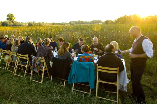 Guests gathered around a table for an outdoor dinner in Boulder, CO