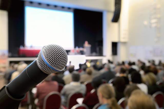 microphone in front of audience at conference