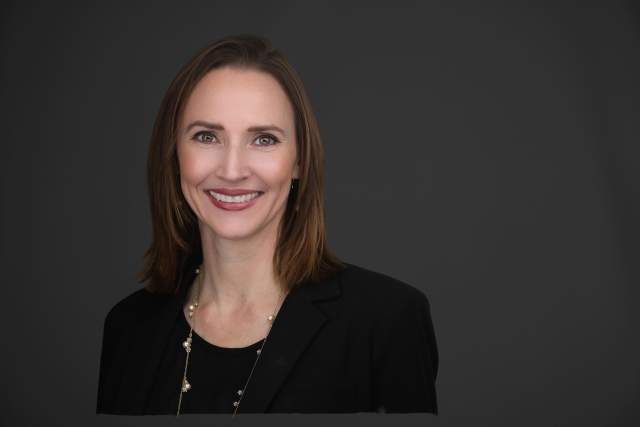 Smiling woman in black dress