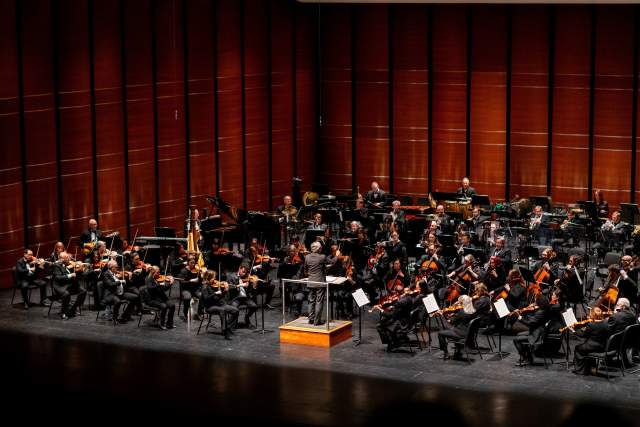 Image the Austin Symphony Orchestra performing on stage.
