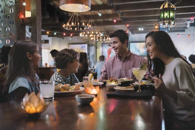 Family of four dining at Uncle Julio's at ICON Park