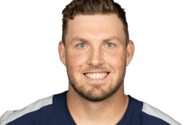 Smiling man in NFL jersey