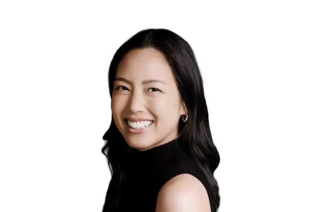 A smiling woman looking at the camera