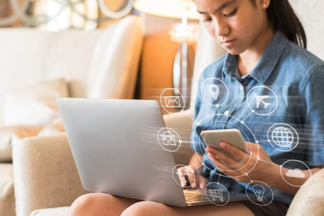 young student or teenager girl using computer, mobile smartphone app technology studying at home