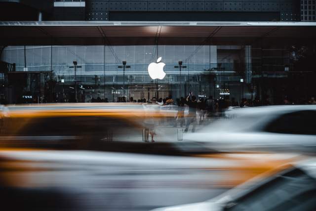 Apple store with people and traffic in front