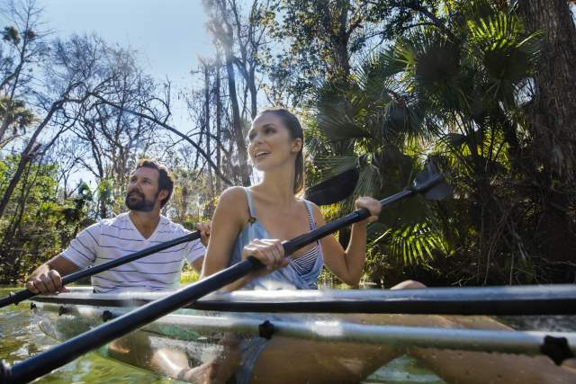 A couple kayaking through King's Landing at Wekiva River