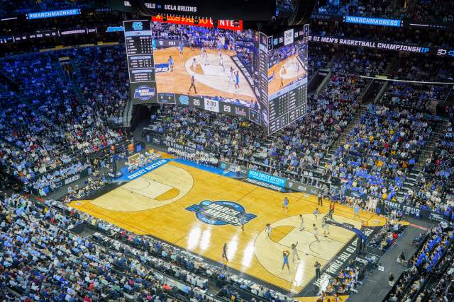 Aerial view of a basketball game being played at Xfinity Mobile Arena in Philadelphia with people in the stands