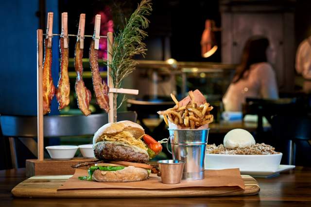 Hamburger and fries at The Edison at Disney Springs