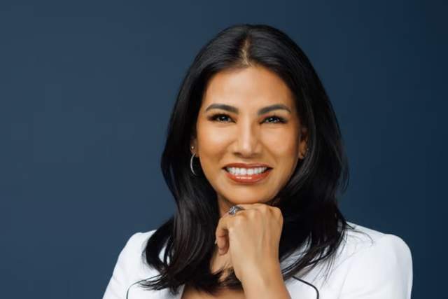 Smiling woman in white suit
