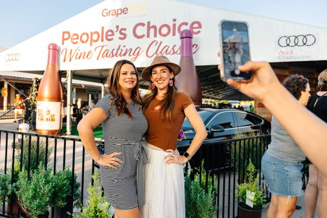 Women photographed outside GrapeFest People's Choice Wine Tasting Classic