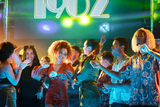 Group of people dancing at club
